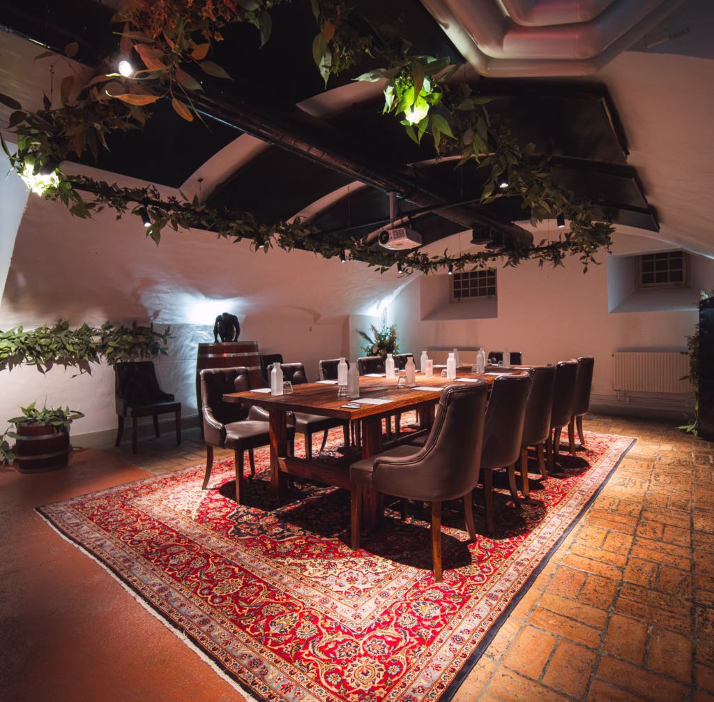 Exclusive meeting room Bellmansalen with leather chairs and wooden tables for confidential arbitration proceedings at Westmanska Palace
